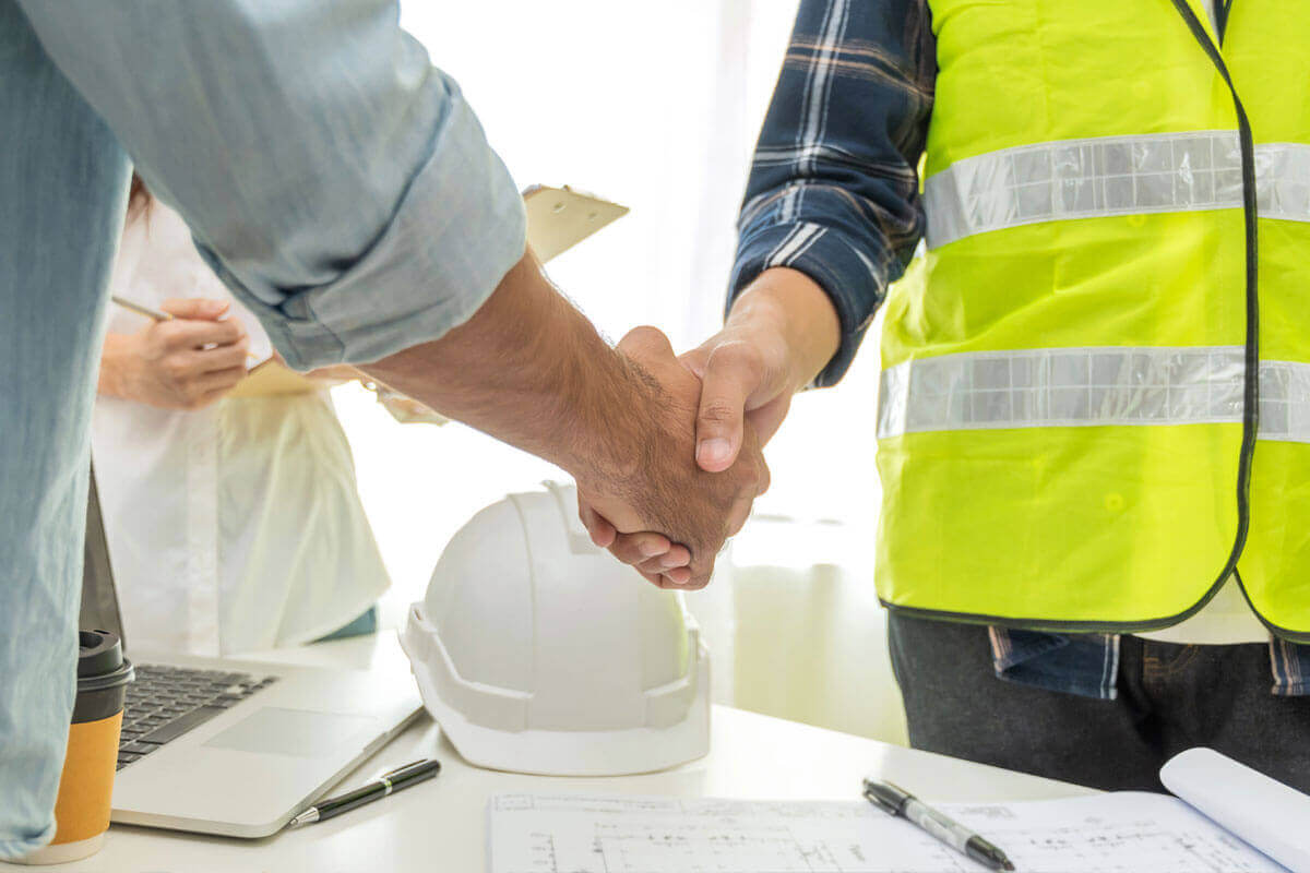 General Contractor shaking hands with client